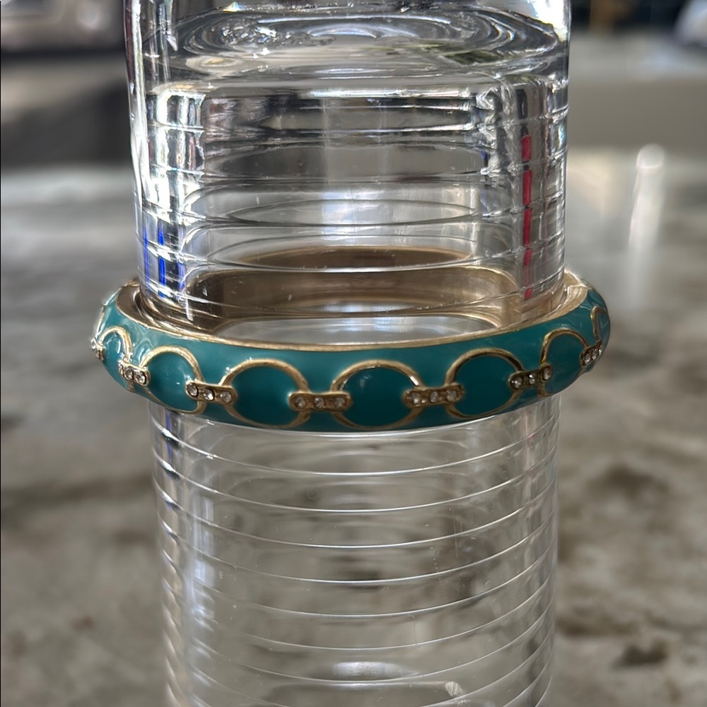 Gold hinged bangle with turquoise enamel and clear gems